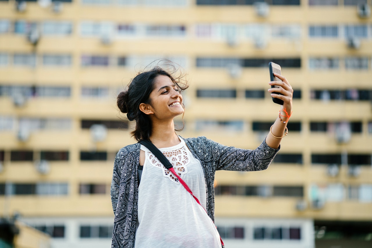 Young Indian woman with her smartphone